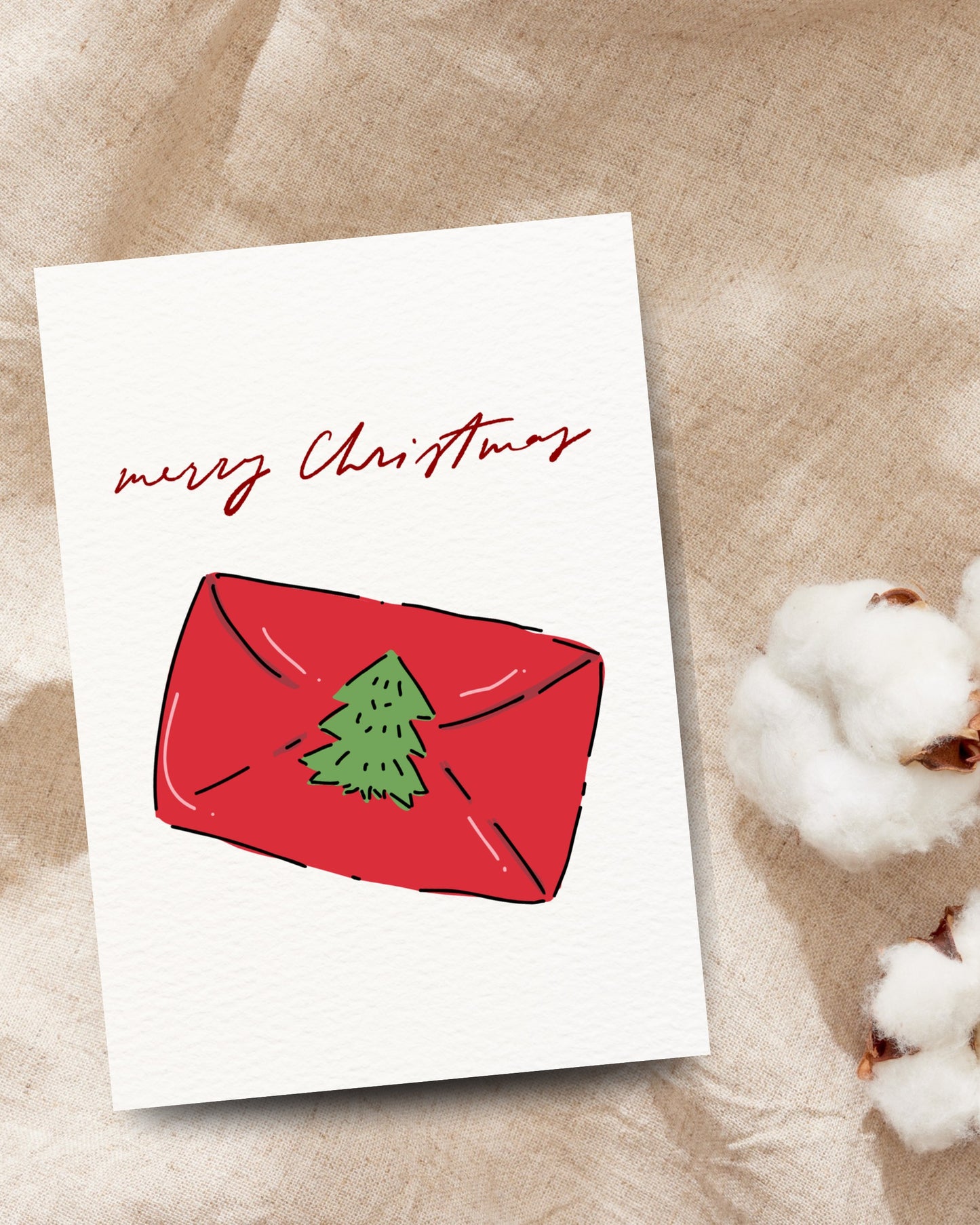 Kerstkaart met rood cadeau envelopje