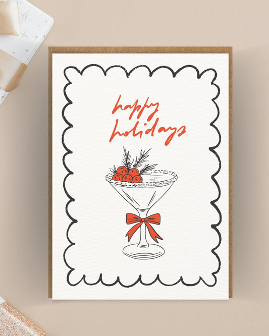 Feestdagenkaart met cocktailglas en besjes