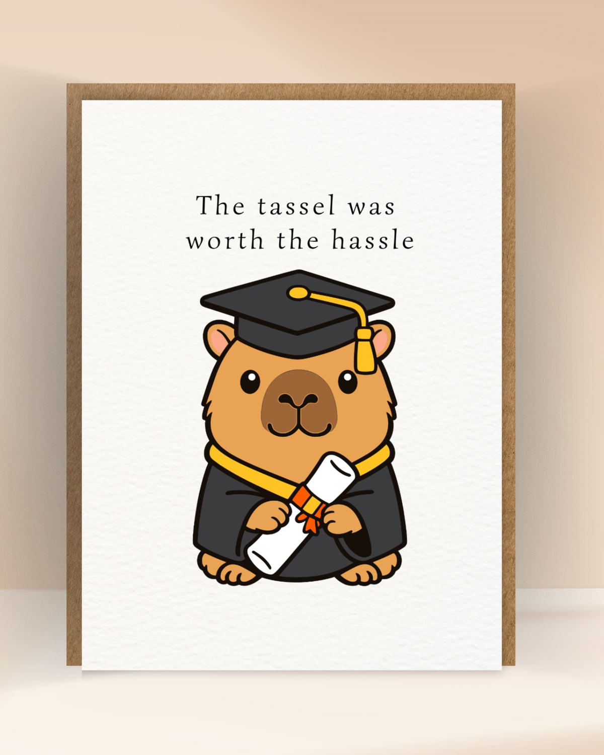 Afstudeerkaart met de tekst ‘The tassel was worth the hassle’ en een capibara met afstudeerhoed en diploma