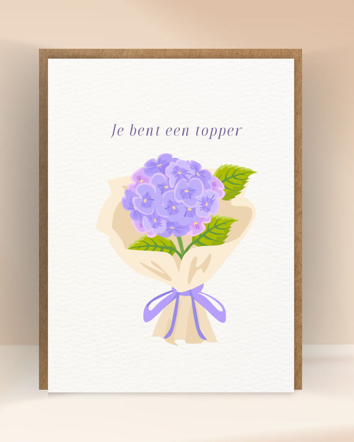Complimentenkaart met de tekst ‘Je bent een topper’ en een paars hortensiaboeket