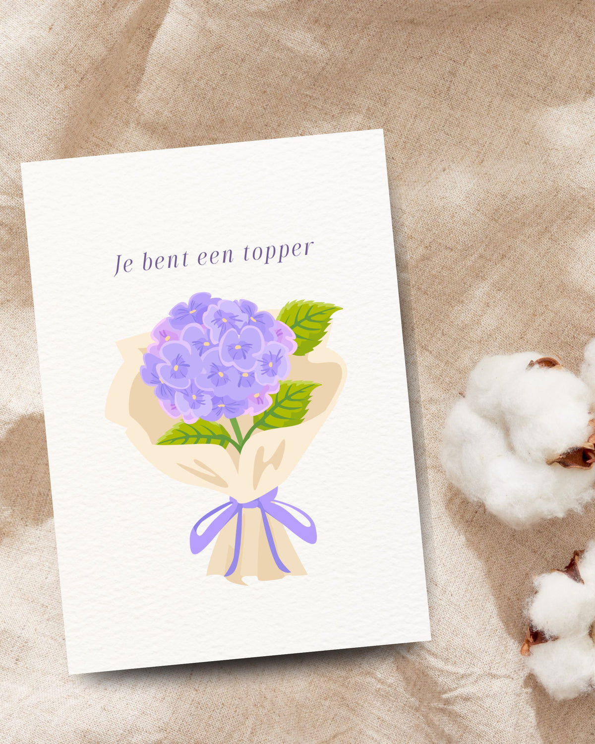 Complimentenkaart met de tekst ‘Je bent een topper’ en een paars hortensiaboeket