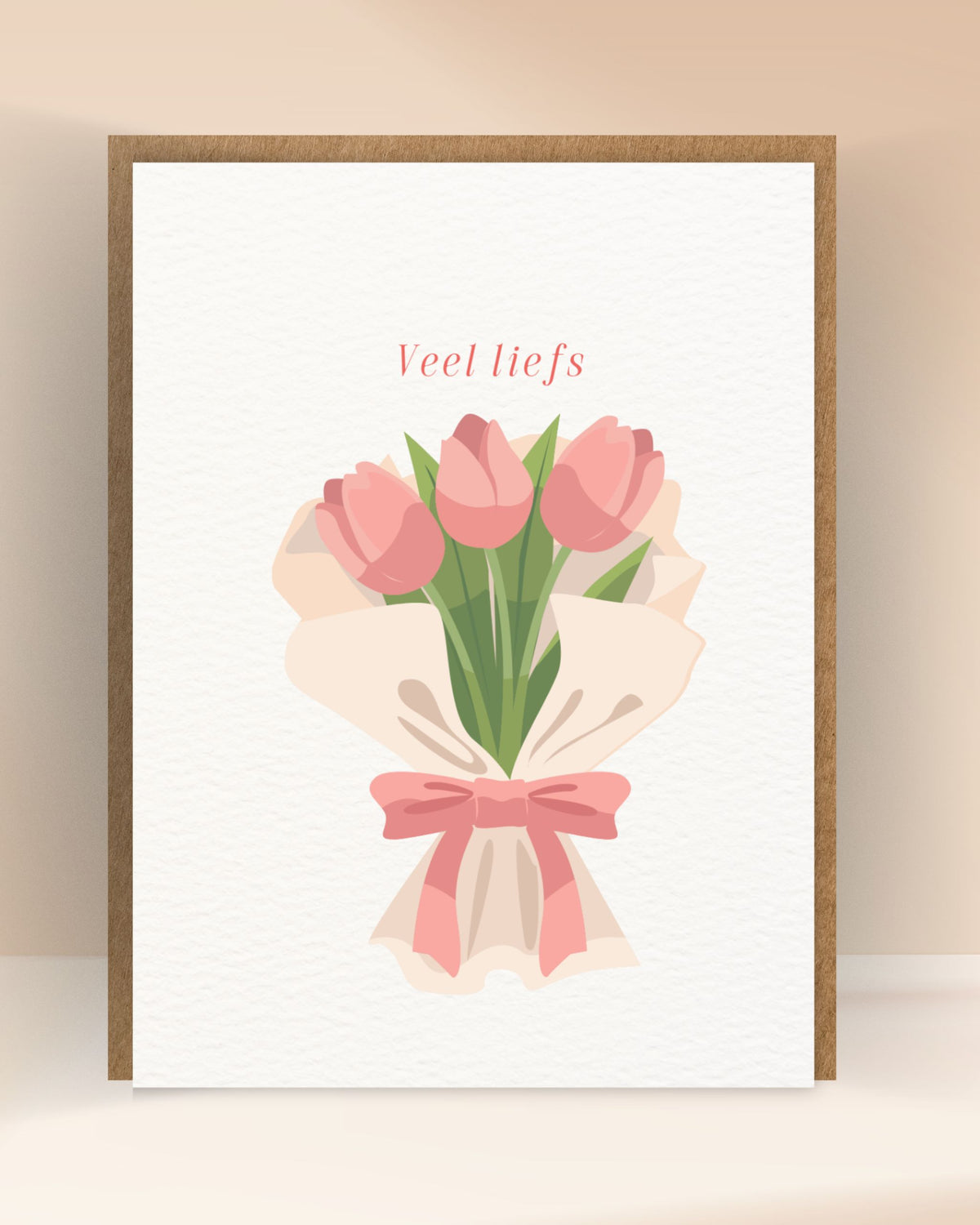 Veel liefs’-wenskaart met een boeket roze tulpen en een roze strik