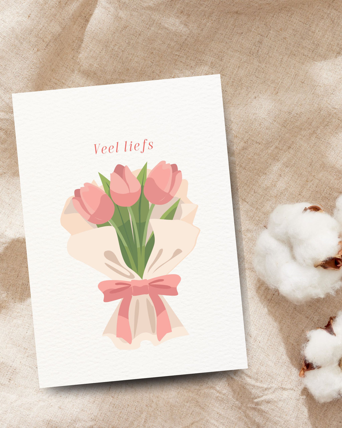 Veel liefs’-wenskaart met een boeket roze tulpen en een roze strik
