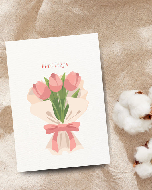 Veel liefs’-wenskaart met een boeket roze tulpen en een roze strik